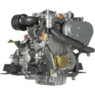 A close-up view of an engine with various mechanical components and hoses.