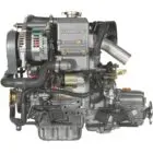 A Yanmar diesel engine with various components and hoses.